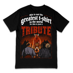 A black short-sleeve t-shirt with a large red and white graphic print on the front, featuring the text 'this is not the greatest t-shirt in the world no. this is just a TRIBUTE' and an illustration of a horned figure above two men sitting by a campfire.